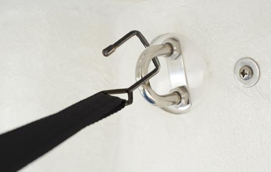 Optional RIDGELINE support system shown attaching to stern of boat using loops. Can also attach to trailer.